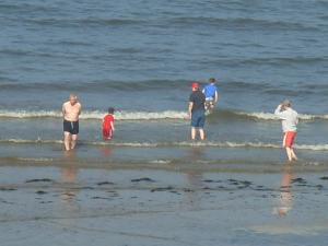 Paddling in the sea at Benllech