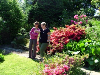 Wendy and Friend in Her Award Winning Garden Wendy and Friend in Her Award Winning Garden